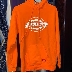 Woman’s orange Dickies hoodie